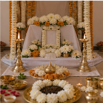 Last Rites Pooja AI image in Bangalore - Completed memorial pooja altar with white flowers and lamps.